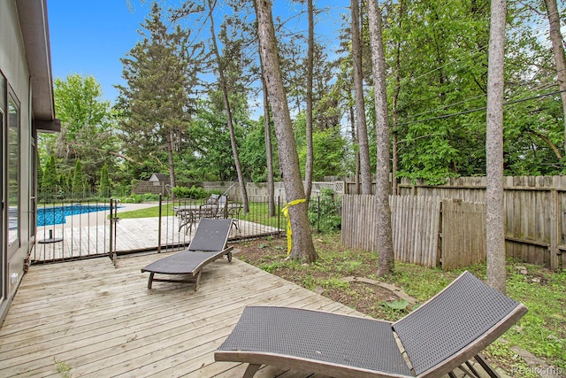 7831 Caberfae Trl, Clarkston, MI 48348 - wooden deck featuring a fenced backyard and view of wooded area