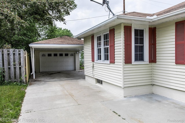 3333 Stone, Port Huron, MI 48060 - view of home's exterior with an outdoor structure, a garage, and roof with shingles
