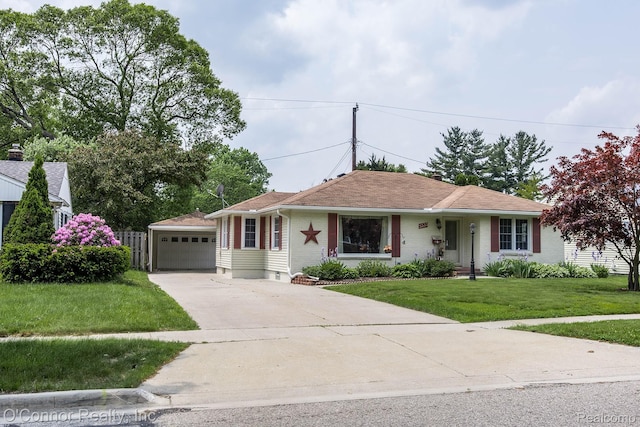 3333 Stone, Port Huron, MI 48060 - ranch-style home with a front yard, driveway, a detached garage, and brick siding