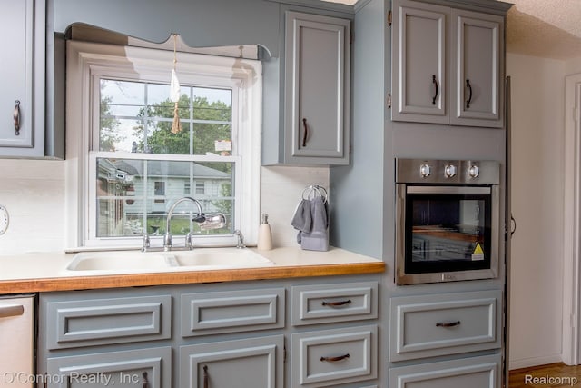 3333 Stone, Port Huron, MI 48060 - kitchen featuring a sink, stainless steel appliances, and gray cabinetry