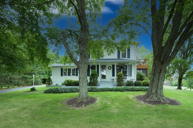 8595 E Napier Ave, Benton Harbor, MI 49022 - traditional style home featuring a front yard and covered porch
