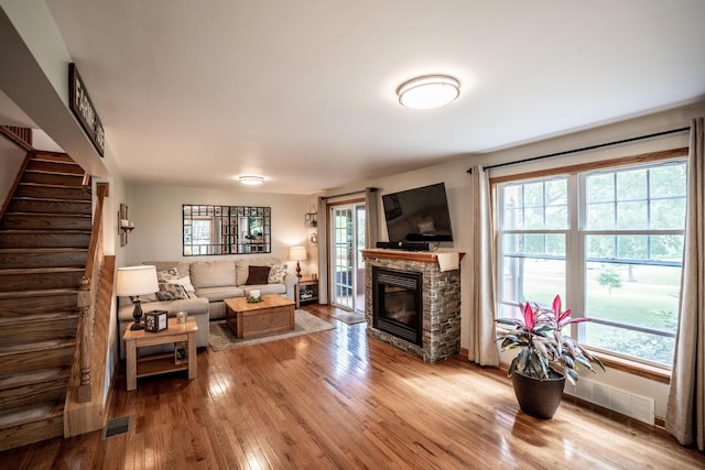 8595 E Napier Ave, Benton Harbor, MI 49022 - living area featuring hardwood / wood-style flooring, plenty of natural light, and stairs
