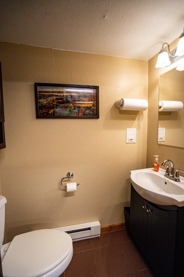 8595 E Napier Ave, Benton Harbor, MI 49022 - half bath with toilet, a baseboard heating unit, vanity, tile patterned flooring, and baseboards