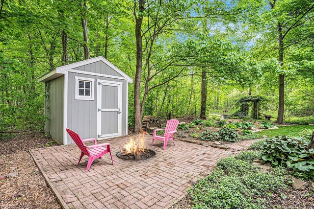 8837 56th Ave, Hudsonville, MI 49426 - view of shed with an outdoor fire pit
