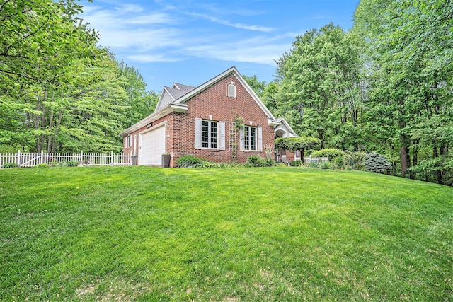 8837 56th Ave, Hudsonville, MI 49426 - view of home's exterior featuring brick siding and a garage