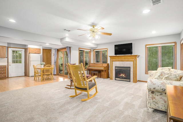 8837 56th Ave, Hudsonville, MI 49426 - living room with healthy amount of natural light, a ceiling fan, recessed lighting, a fireplace, and baseboards