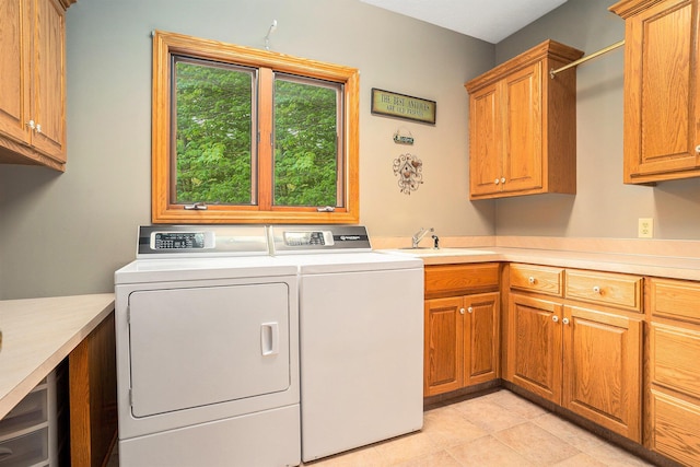 8837 56th Ave, Hudsonville, MI 49426 - washroom featuring cabinet space, washing machine and dryer, and light tile patterned floors