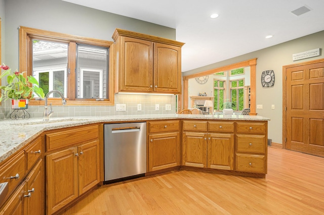 8837 56th Ave, Hudsonville, MI 49426 - kitchen featuring dishwasher, light wood-style flooring, a sink, healthy amount of natural light, and recessed lighting