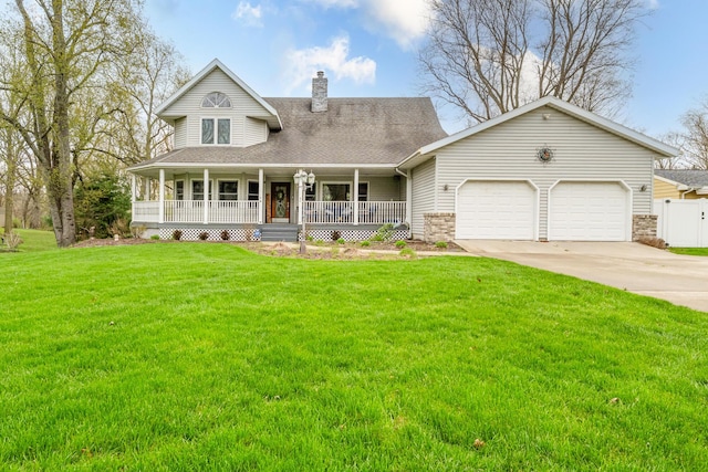 4569 Terra Ln, Saint Joseph, MI 49085 - view of front facade with a porch, a garage, a chimney, driveway, and a front yard