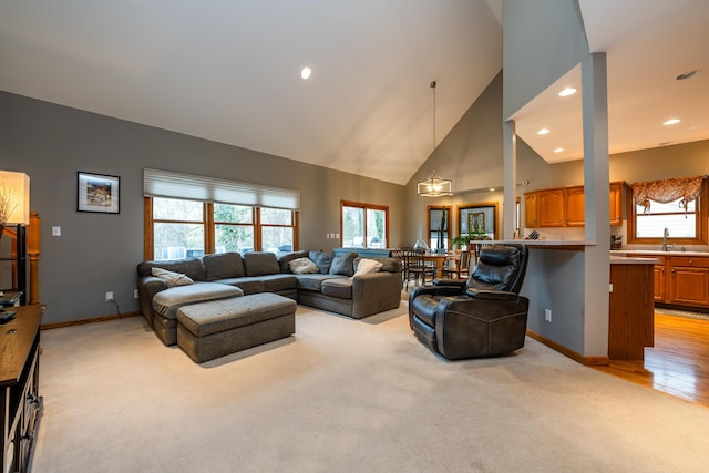 4569 Terra Ln, Saint Joseph, MI 49085 - living room with light colored carpet, recessed lighting, and high vaulted ceiling
