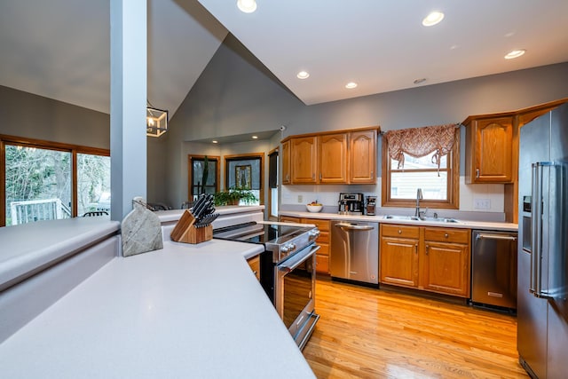 4569 Terra Ln, Saint Joseph, MI 49085 - kitchen featuring stainless steel appliances, light countertops, light wood-style flooring, recessed lighting, and brown cabinets