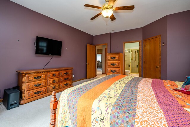 4569 Terra Ln, Saint Joseph, MI 49085 - carpeted bedroom with ensuite bathroom and ceiling fan