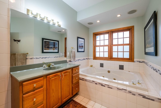 4569 Terra Ln, Saint Joseph, MI 49085 - bathroom with vanity, tile patterned flooring, a jetted tub, and recessed lighting