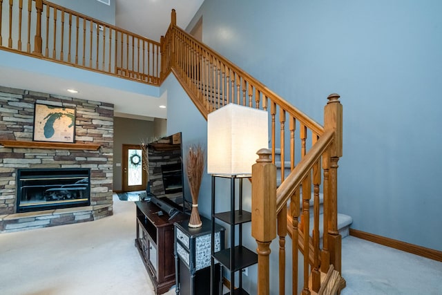 4569 Terra Ln, Saint Joseph, MI 49085 - stairway featuring carpet, a fireplace, and a high ceiling
