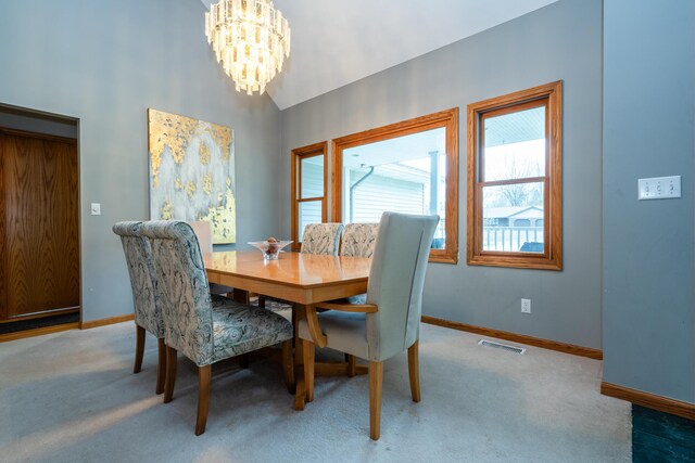 4569 Terra Ln, Saint Joseph, MI 49085 - dining space featuring a chandelier, light colored carpet, and lofted ceiling