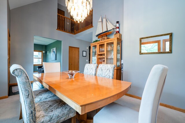 4569 Terra Ln, Saint Joseph, MI 49085 - dining space with a chandelier and a high ceiling
