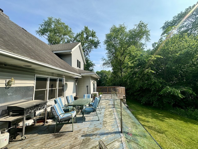 4569 Terra Ln, Saint Joseph, MI 49085 - wooden terrace featuring outdoor dining area and a lawn