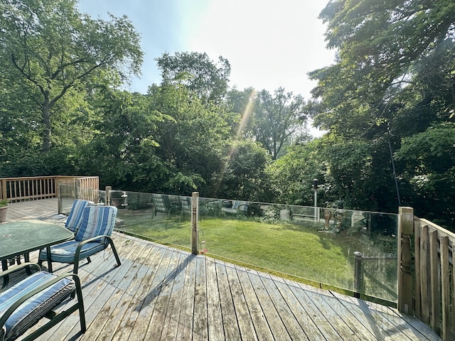 4569 Terra Ln, Saint Joseph, MI 49085 - wooden terrace with outdoor dining space and view of scattered trees