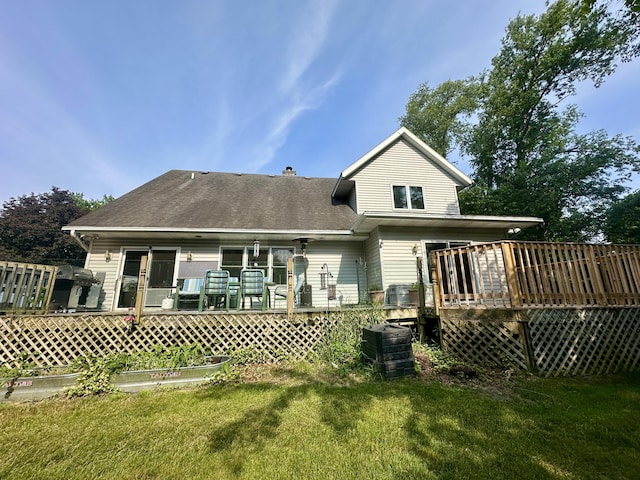 4569 Terra Ln, Saint Joseph, MI 49085 - rear view of house with a yard, a deck, and a shingled roof