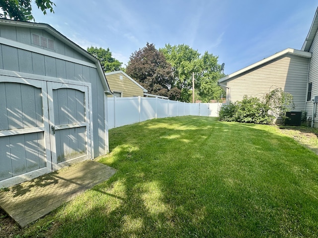 4569 Terra Ln, Saint Joseph, MI 49085 - fenced backyard featuring a storage unit