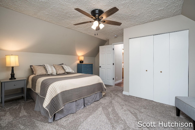 9953 10 Mile Rd NE, Rockford, MI 49341 - bedroom featuring carpet flooring, lofted ceiling, a textured ceiling, a closet, and ceiling fan
