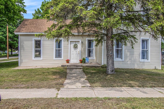 501 E Paw Paw St, Paw Paw, MI 49079 - view of front of home featuring a front lawn