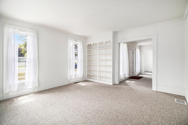 501 E Paw Paw St, Paw Paw, MI 49079 - carpeted empty room with ornamental molding, baseboards, and built in shelves