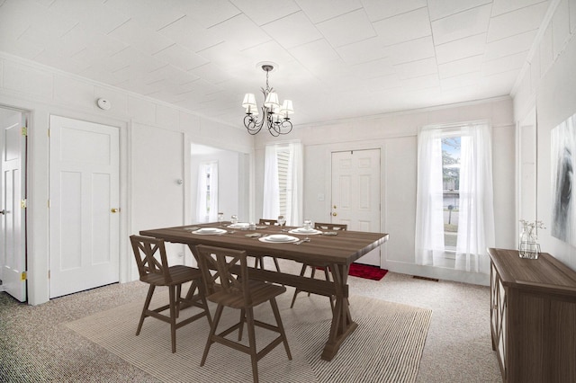 501 E Paw Paw St, Paw Paw, MI 49079 - dining space with crown molding and a chandelier