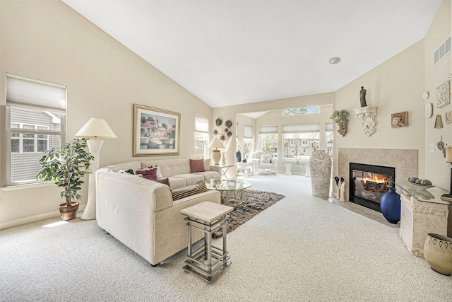 159 Water Lily Way NE, Comstock Park, MI 49321 - living area with carpet, a tile fireplace, high vaulted ceiling, and baseboards