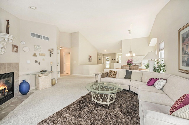 159 Water Lily Way NE, Comstock Park, MI 49321 - living room with a fireplace, carpet flooring, high vaulted ceiling, a chandelier, and baseboards