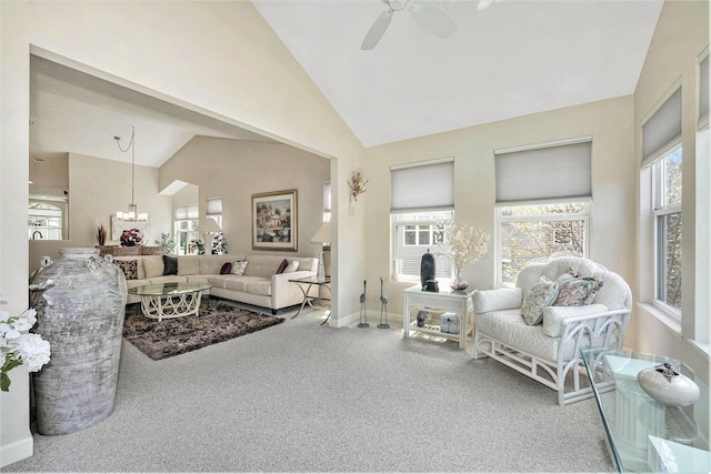 159 Water Lily Way NE, Comstock Park, MI 49321 - carpeted living room with healthy amount of natural light, a ceiling fan, baseboards, high vaulted ceiling, and a chandelier