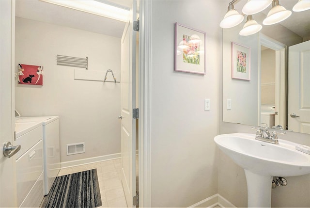 159 Water Lily Way NE, Comstock Park, MI 49321 - bathroom with independent washer and dryer and baseboards