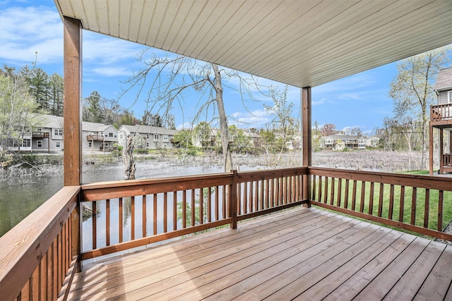 159 Water Lily Way NE, Comstock Park, MI 49321 - wooden terrace with a residential view and a water view