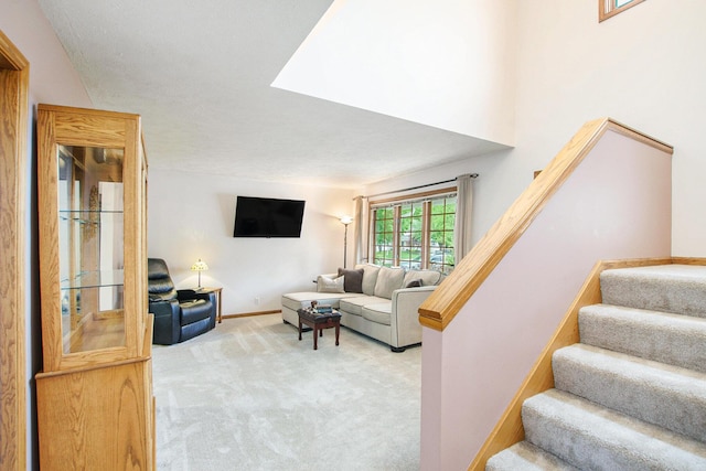2481 Jameswood Ct, Holland, MI 49424 - living room featuring stairs, carpet, and baseboards
