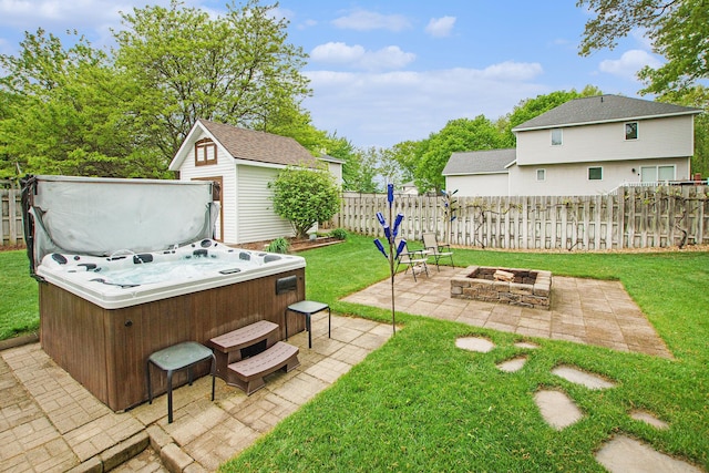 2481 Jameswood Ct, Holland, MI 49424 - view of yard featuring a hot tub, an outdoor fire pit, and a patio