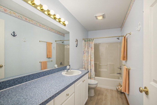 2481 Jameswood Ct, Holland, MI 49424 - bathroom featuring toilet, vanity, wood finished floors, and shower / bathtub combination with curtain