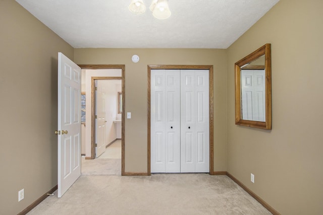 2481 Jameswood Ct, Holland, MI 49424 - unfurnished bedroom featuring light colored carpet, baseboards, and a closet