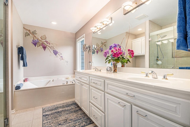 2176 Teal Ct SE, Grand Rapids, MI 49546 - full bath with double vanity, a bath, a stall shower, and tile patterned floors