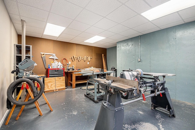 2176 Teal Ct SE, Grand Rapids, MI 49546 - miscellaneous room featuring a workshop area, a drop ceiling, and concrete flooring