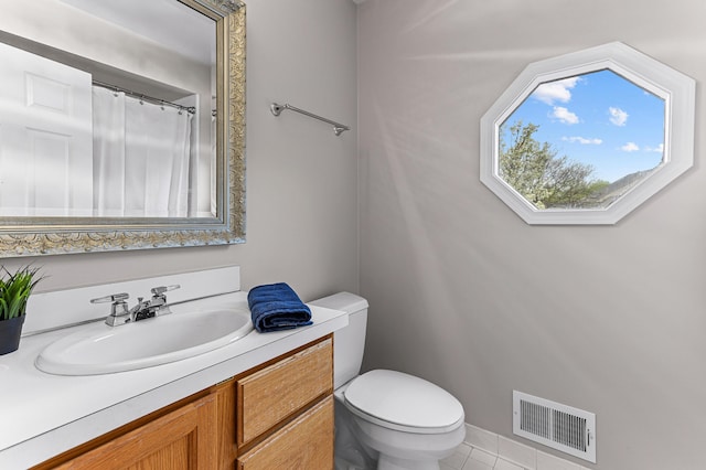 2485 Wildbrook Run Unit 154, Bloomfield Hills, MI 48304 - bathroom featuring toilet, vanity, and tile patterned flooring