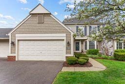 2485 Wildbrook Run Unit 154, Bloomfield Hills, MI 48304 - traditional-style house with a garage and asphalt driveway
