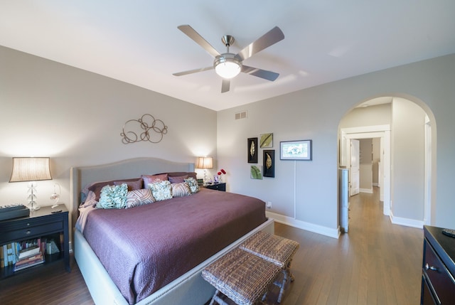 300 Morning Walk Path, Benton Harbor, MI 49022 - bedroom featuring arched walkways, wood finished floors, baseboards, and ceiling fan