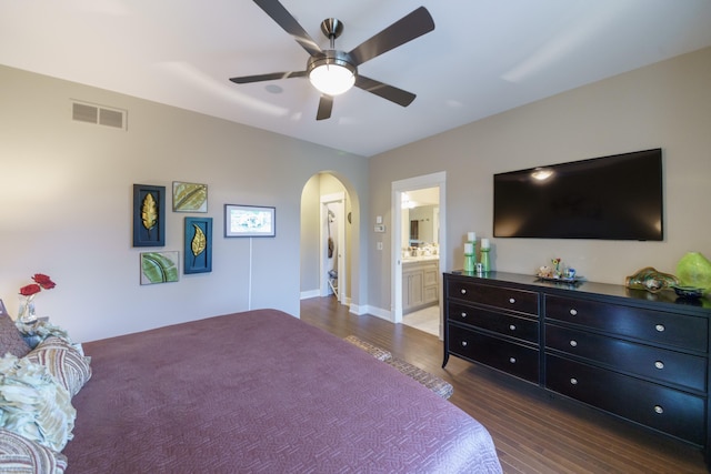 300 Morning Walk Path, Benton Harbor, MI 49022 - bedroom featuring arched walkways, wood finished floors, ceiling fan, ensuite bathroom, and baseboards