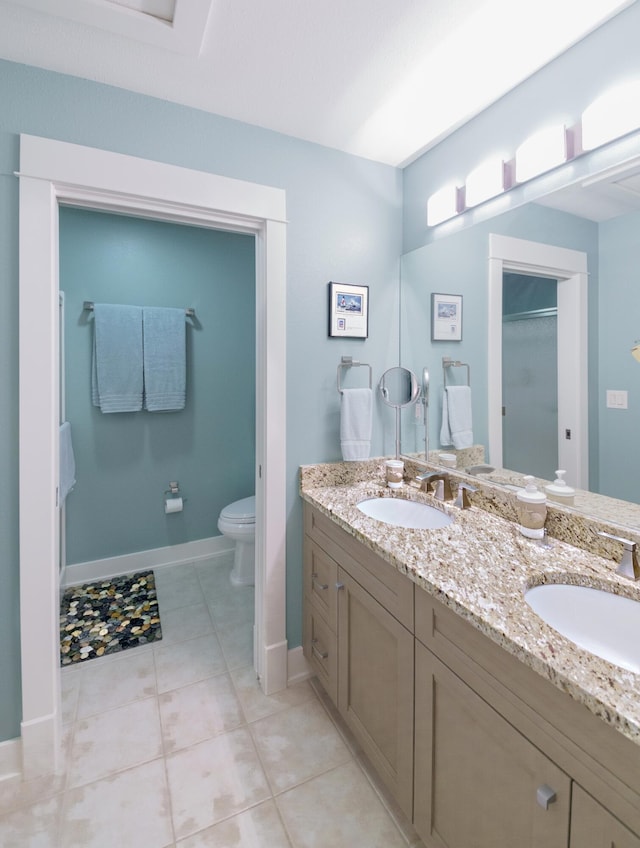 300 Morning Walk Path, Benton Harbor, MI 49022 - full bathroom with double vanity, toilet, baseboards, and tile patterned floors