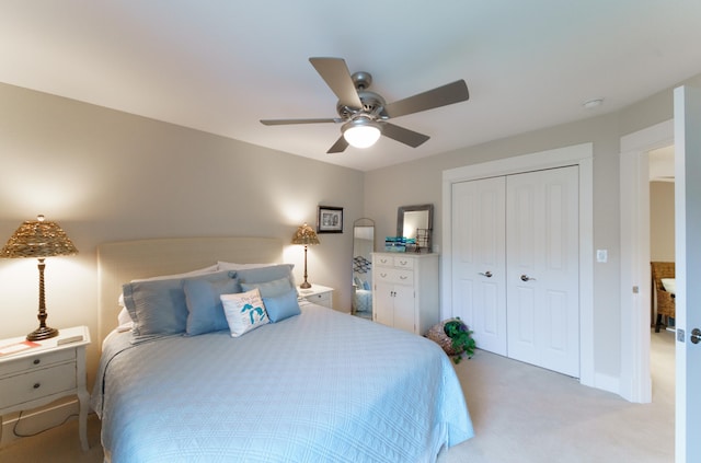 300 Morning Walk Path, Benton Harbor, MI 49022 - bedroom with light carpet, a closet, a ceiling fan, and baseboards
