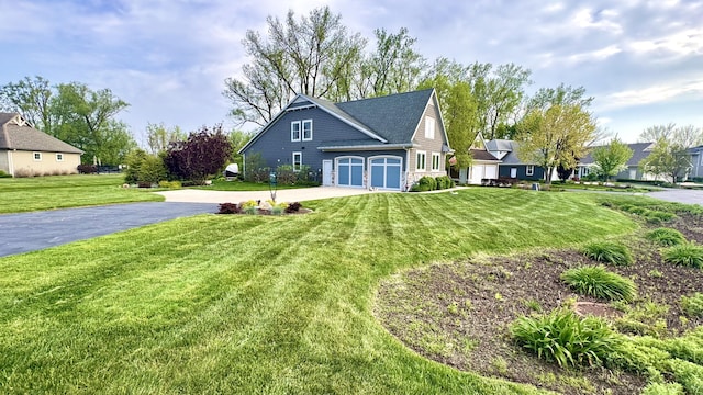 300 Morning Walk Path, Benton Harbor, MI 49022 - view of front of property featuring driveway, a front lawn, and a garage