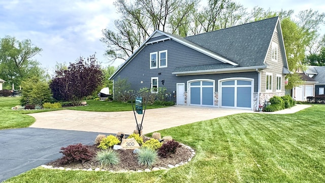 300 Morning Walk Path, Benton Harbor, MI 49022 - view of side of property featuring driveway, a lawn, and stone siding