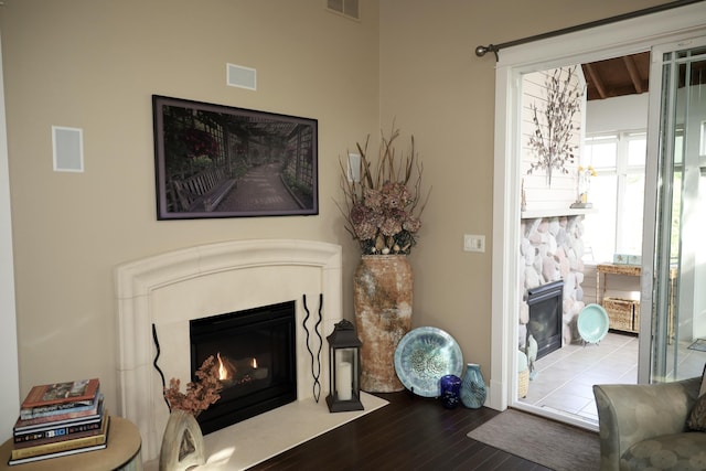 300 Morning Walk Path, Benton Harbor, MI 49022 - living room featuring a fireplace with flush hearth, wood finished floors, and beam ceiling