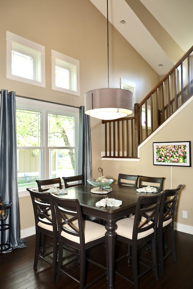 300 Morning Walk Path, Benton Harbor, MI 49022 - dining room featuring high vaulted ceiling, baseboards, dark wood-style flooring, and stairway
