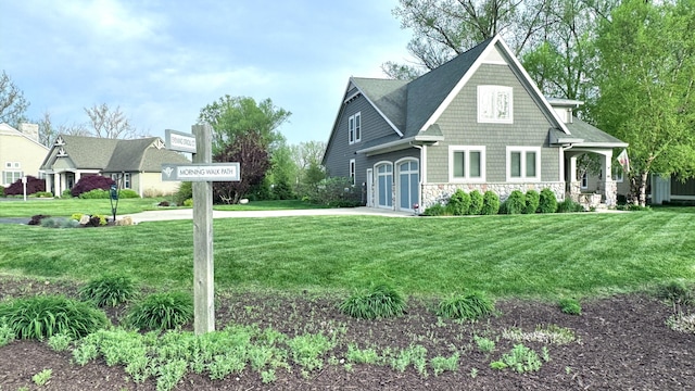 300 Morning Walk Path, Benton Harbor, MI 49022 - shingle-style home featuring stone siding, concrete driveway, and a front lawn